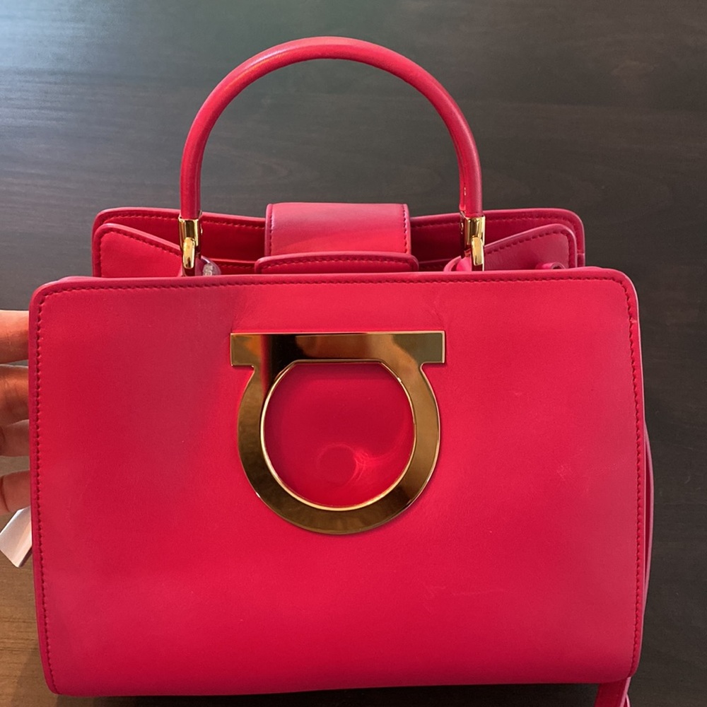 Salvatore Ferragamo Crossbody bag with top handle.